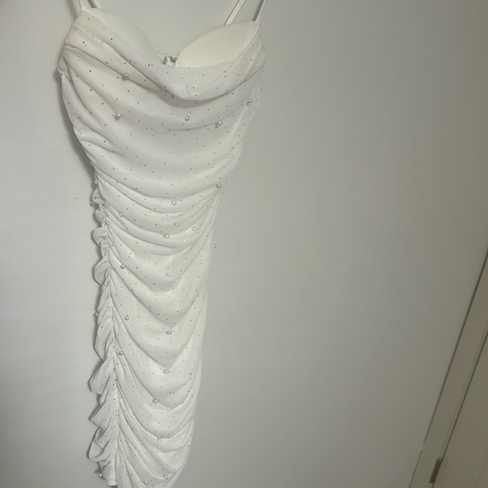 A mini white dress that’s super cute and could be worn anywhere